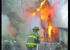 Several fire departments responded to a structure fire at Ricketts on Nov. 20 at 7:58 a.m., including Ricketts, Denison, Charter Oak and Schleswig. Firefighters were ordered out of the house after it was reported weapons and ammunition were in the home. Photo by Jim Clark.	